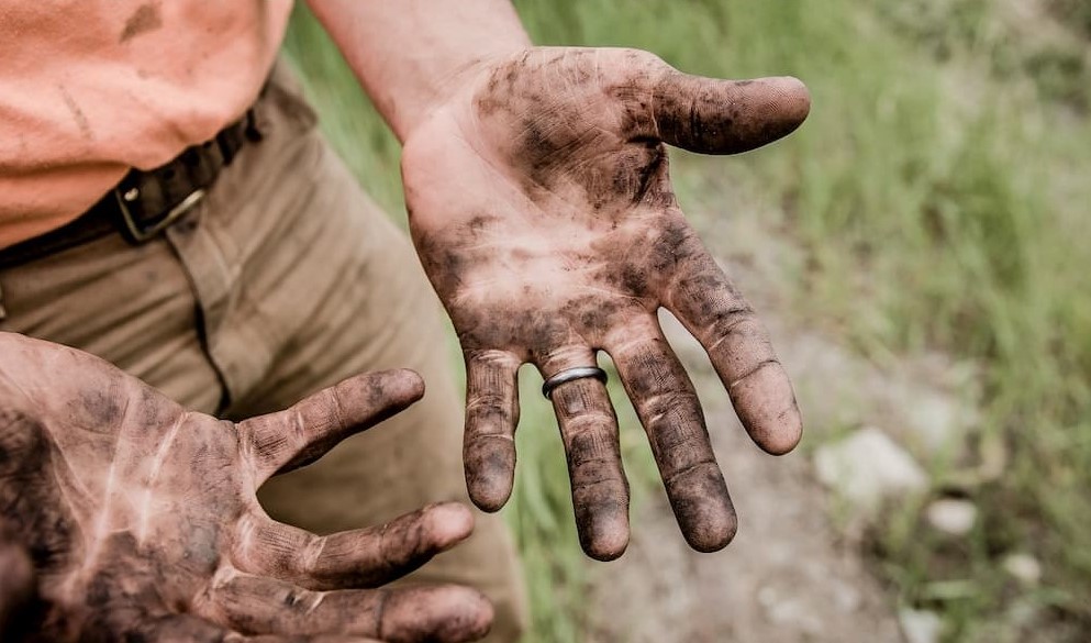 hard worker with dirty hands