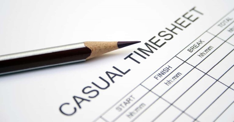 A printed casual workers timesheet with a black pencil resting on top of it. Used to calculate average hours worked for a WorkCover injury compensation for casual employees in Queensland.