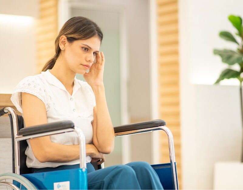 Woman with physical injury whose recovery is affected by psychological and emotional strain