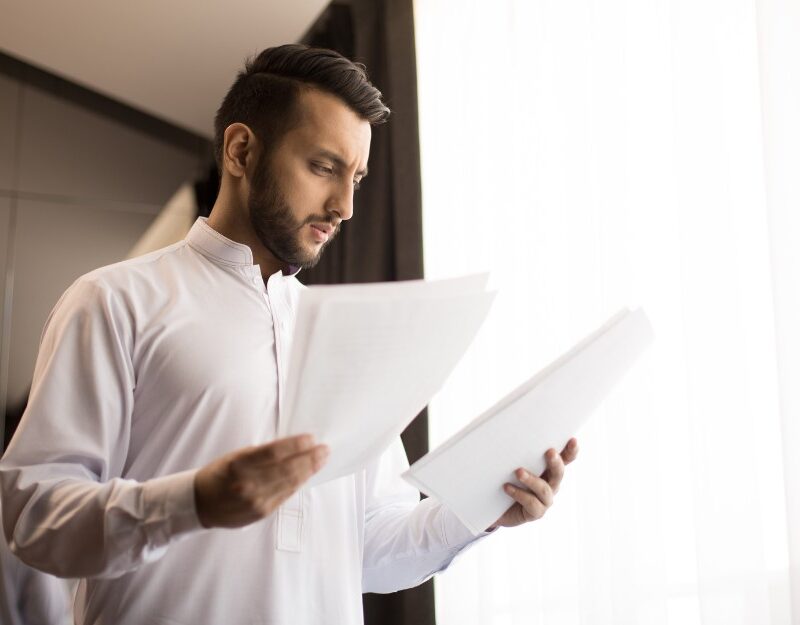 Man reading a NOA document, receiving a 0% whole person impairment assessment